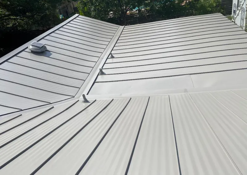 Solar attic fan installed on a metal roof for Roof Ventilation in Miami Beach