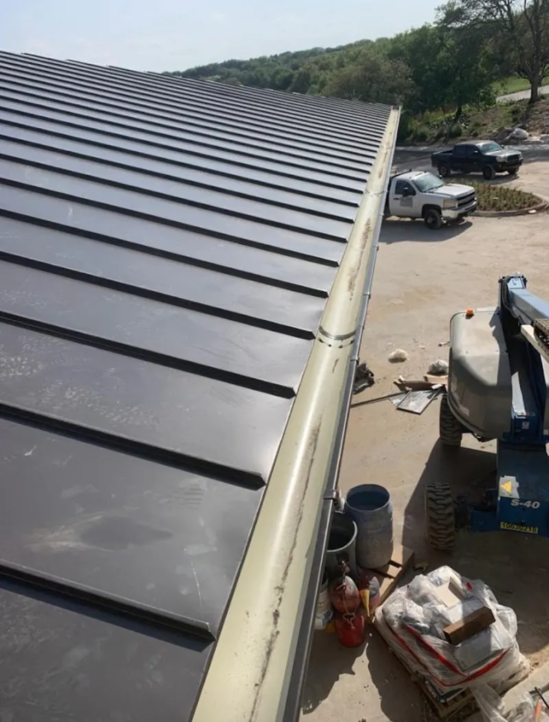 Standing seam panel and gutter detail on a metal roofing jobsite in Miami Beach